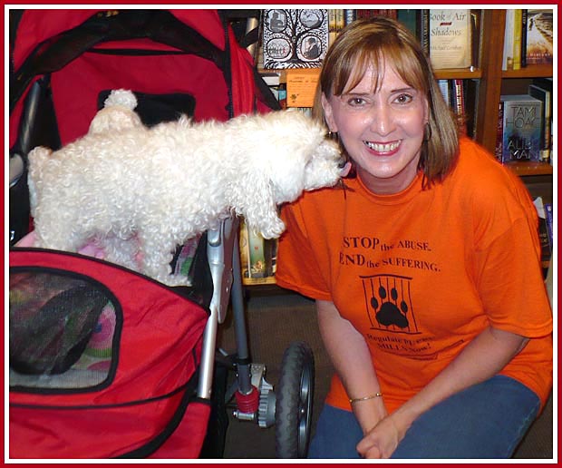 Baby, Puppy Mill Survivor, greets Debbie, NoWisconsinPuppyMills supporter, at a booksigning in Milwaukee, WI on 2 July 2008