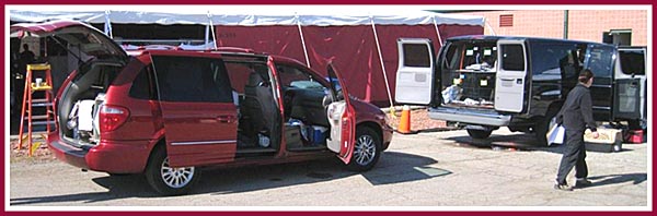 Loaded vans in front of the temporary housing tents at Dane Co. HS prepare to transport some of the 200 dogs to shelters across WI.